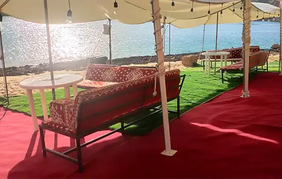 Exploring the Beaches of Oman: Which One Will You Enjoy the Most? 5 Traditional arrangement at Al Khiran Beach with a stunning view of the sea.