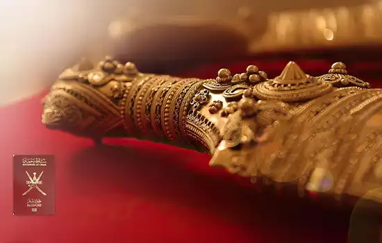  An artistic image of a traditional Omani dagger alongside the Omani passport, symbolizing the country’s cultural heritage and global strength.